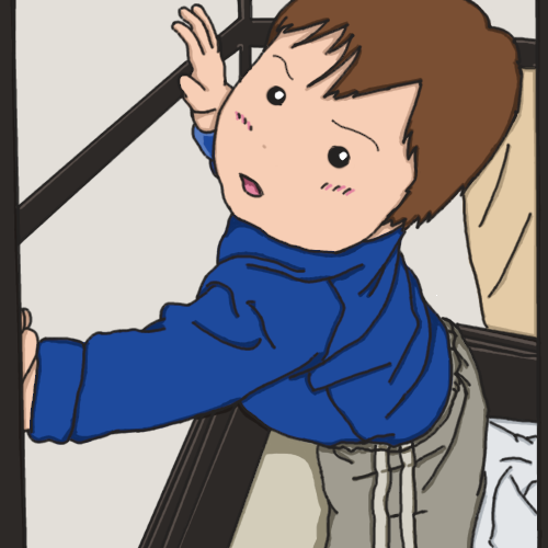 つかまり立ちをする赤ちゃん